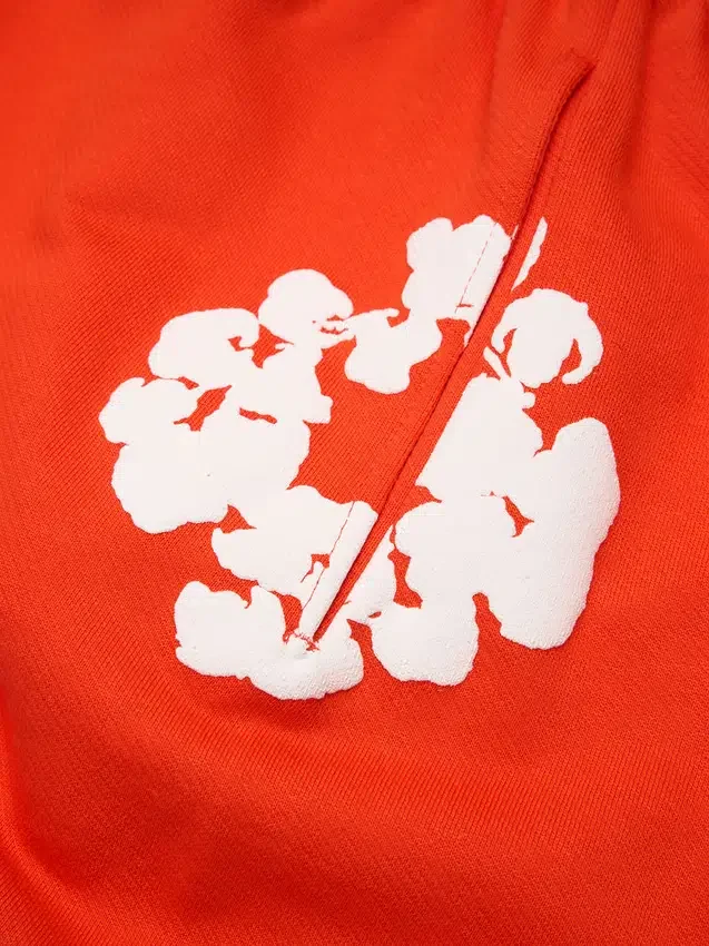 Bawełniane spodnie dresowe typu baggy z motywem Cotton Wreath, ciemny pomarańczowy